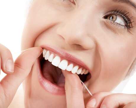 beautiful women flossing hove dental