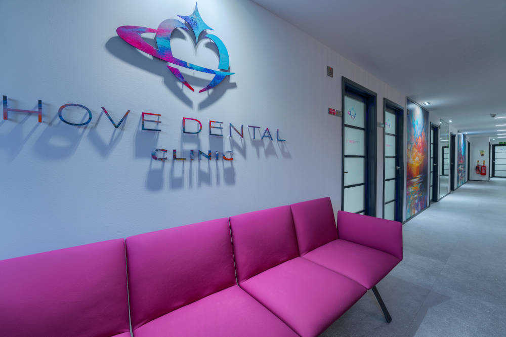 a photo of a pink couch in Hove Dental waiting room